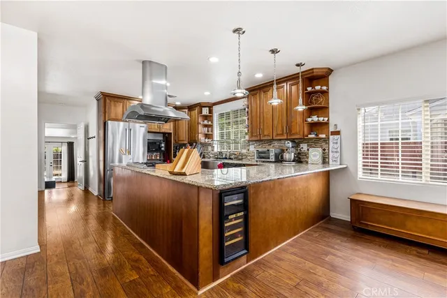 a kitchen with stainless steel appliances granite countertop a stove and a sink