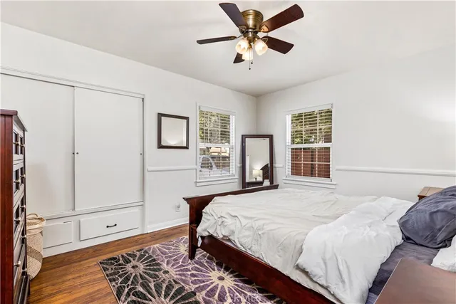 a bedroom with a large bed and a window