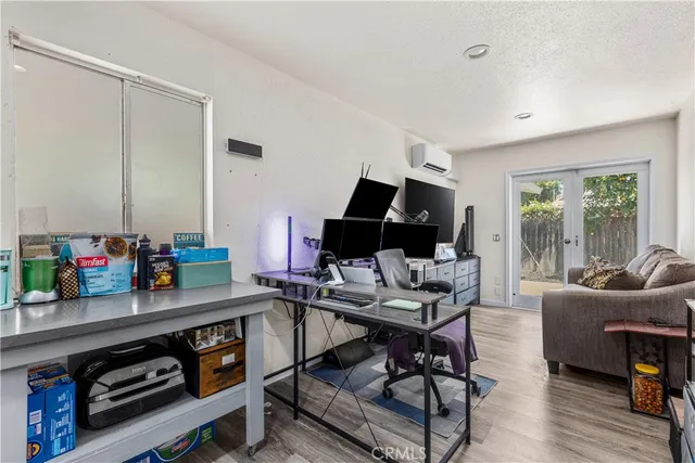 a work room with furniture and wooden floor