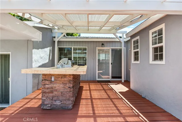 a view of hall with wooden floor and a fireplace