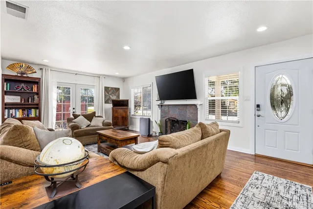 a living room with furniture fireplace and a flat screen tv