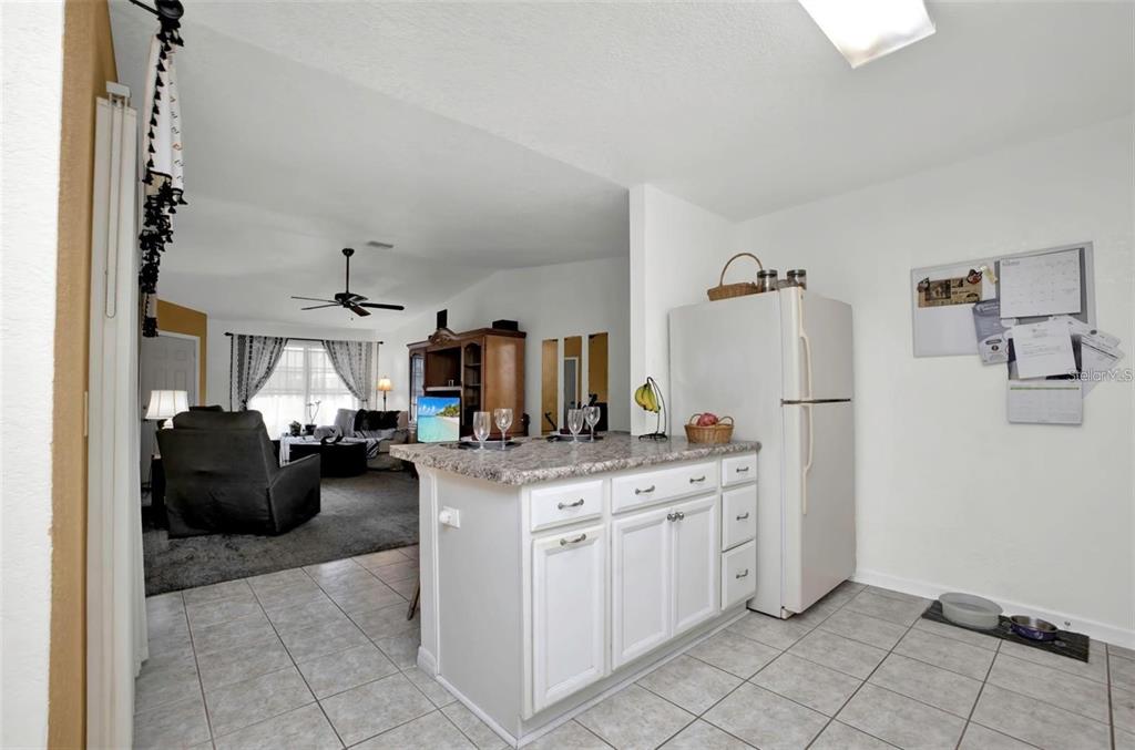 3520 Kenneth Road Port Charlotte, FL 33953 - Photo 12 of 43 a kitchen that has a lot of cabinets in it