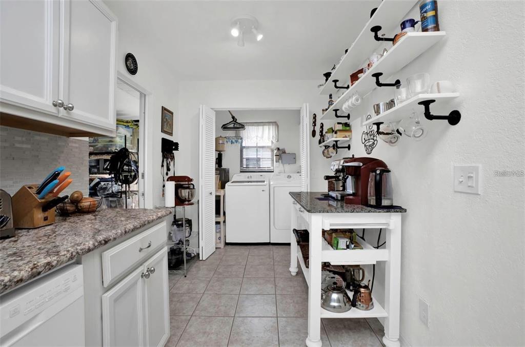 3520 Kenneth Road Port Charlotte, FL 33953 - Photo 13 of 43 a kitchen with stainless steel appliances granite countertop a sink and cabinets