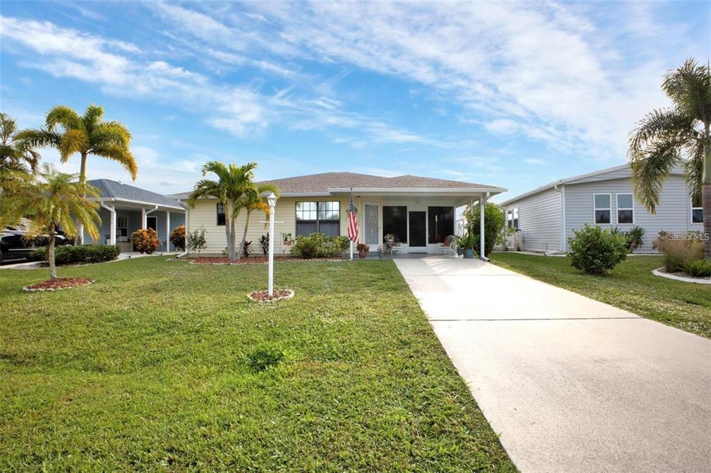 3520 Kenneth Road Port Charlotte, FL 33953 - Photo 2 of 43 a view of house with a yard