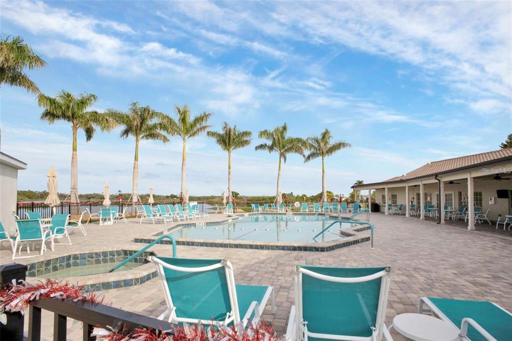 3520 Kenneth Road Port Charlotte, FL 33953 - Photo 35 of 43 a view of a swimming pool and lounge chairs