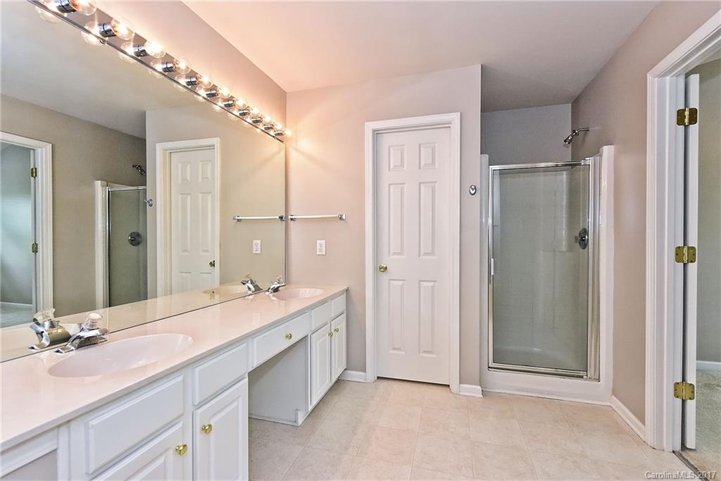 15319 McClure Bridge Road, Unit L90 Charlotte, NC 28277 - Photo 15 of 19 a bathroom with a double vanity sink mirror and double