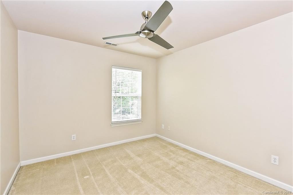 15319 McClure Bridge Road, Unit L90 Charlotte, NC 28277 - Photo 16 of 19 an empty room with a window