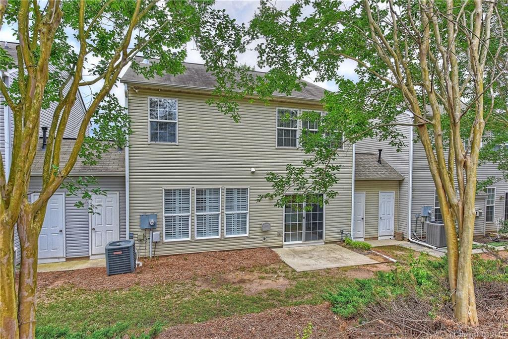 15319 McClure Bridge Road, Unit L90 Charlotte, NC 28277 - Photo 19 of 19 front view of a house with a yard