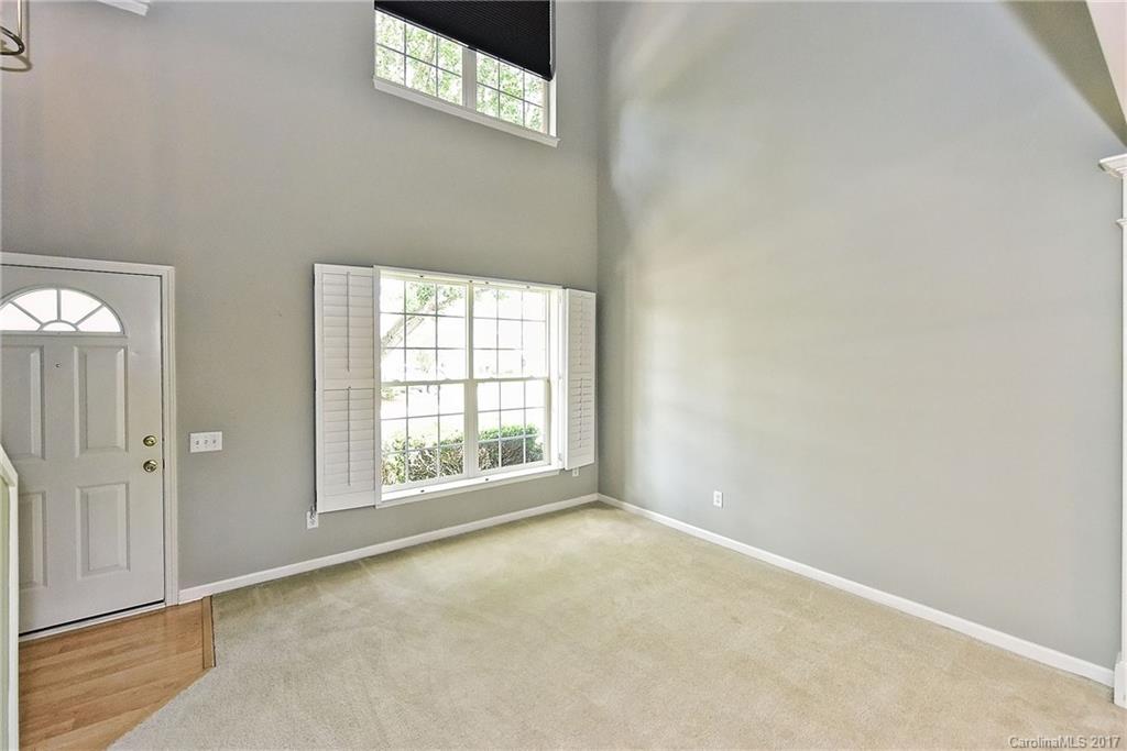 15319 McClure Bridge Road, Unit L90 Charlotte, NC 28277 - Photo 3 of 19 an empty room with windows