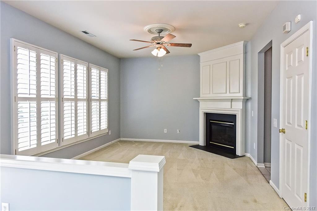 15319 McClure Bridge Road, Unit L90 Charlotte, NC 28277 - Photo 10 of 19 a view of empty room with a ceiling fan and window