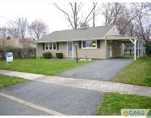 23 Kenmore Road Edison, NJ 08817 - Photo 1 of 8 front view of a house and a yard