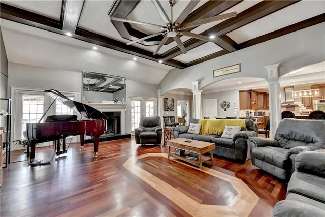 a dining room with furniture and wooden floor