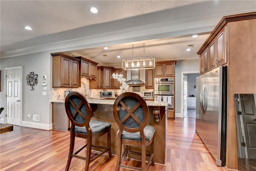 4420 Benefield Road Braselton, GA 30517 - Photo 16 of 34 a dining room with furniture and wooden floor