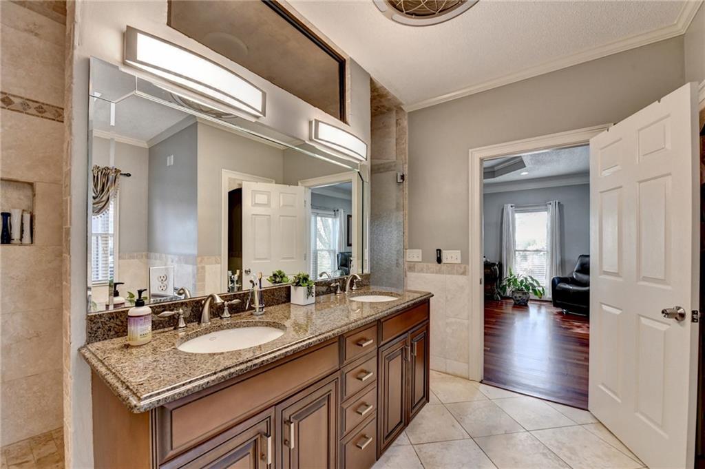 4420 Benefield Road Braselton, GA 30517 - Photo 20 of 34 a bathroom with a sink and a mirror