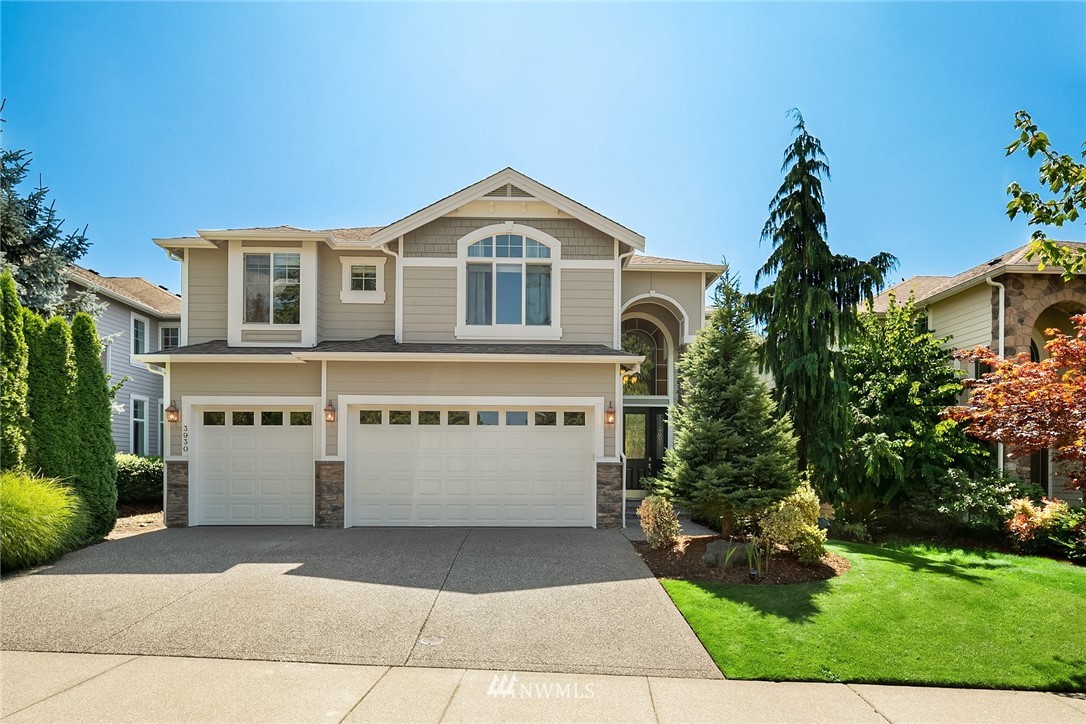 3930 215th Street Southeast Bothell, WA 98021 - Photo 1 of 35 a front view of a house with garden