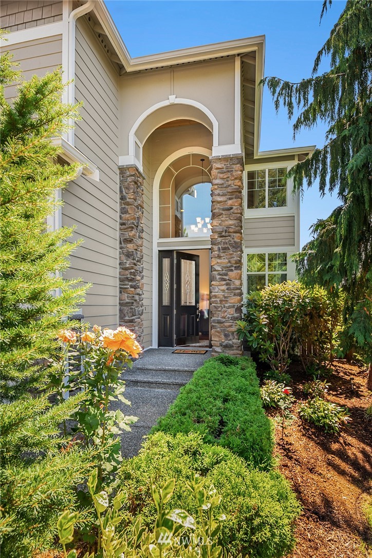 3930 215th Street Southeast Bothell, WA 98021 - Photo 2 of 35 a house view with a garden space