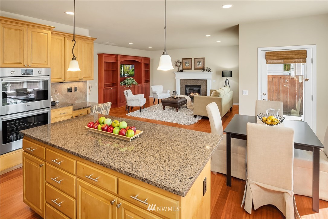 3930 215th Street Southeast Bothell, WA 98021 - Photo 12 of 35 a kitchen with sink stove and cabinets