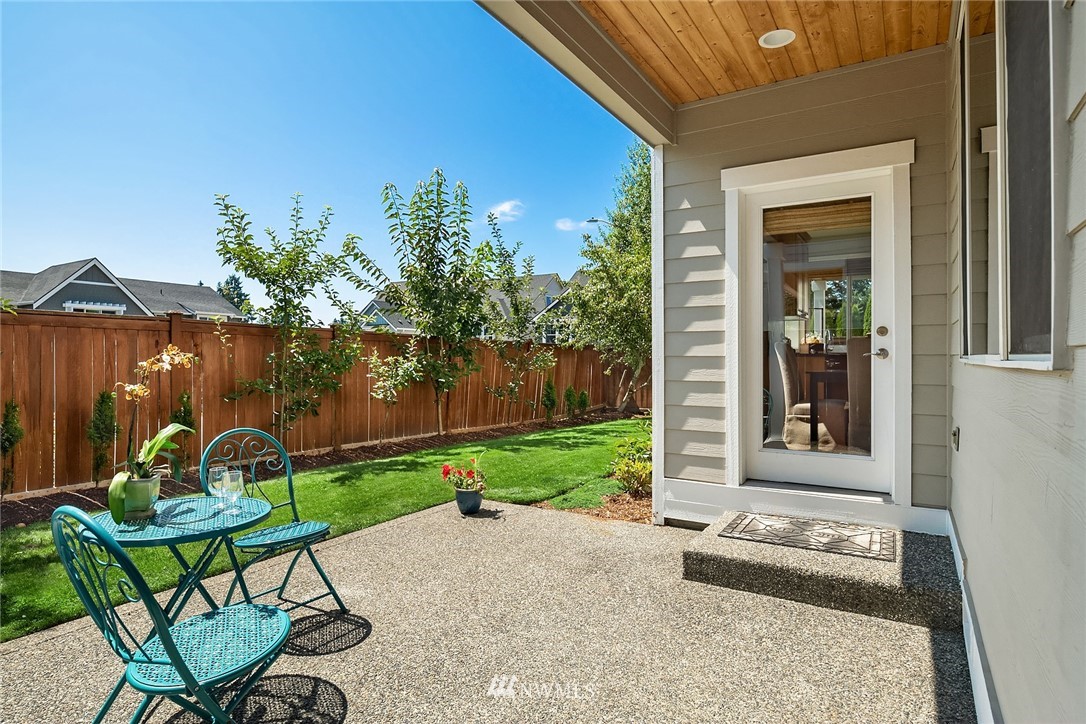 3930 215th Street Southeast Bothell, WA 98021 - Photo 13 of 35 a backyard of a house with table and chairs