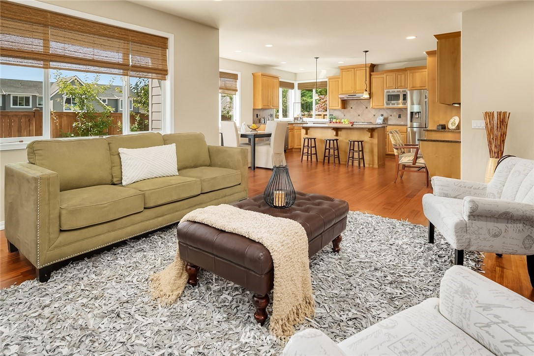 3930 215th Street Southeast Bothell, WA 98021 - Photo 15 of 35 a living room with furniture wooden floor and a large window