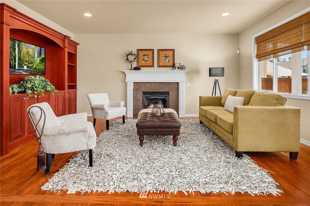3930 215th Street Southeast Bothell, WA 98021 - Photo 16 of 35 a living room with furniture and a fireplace