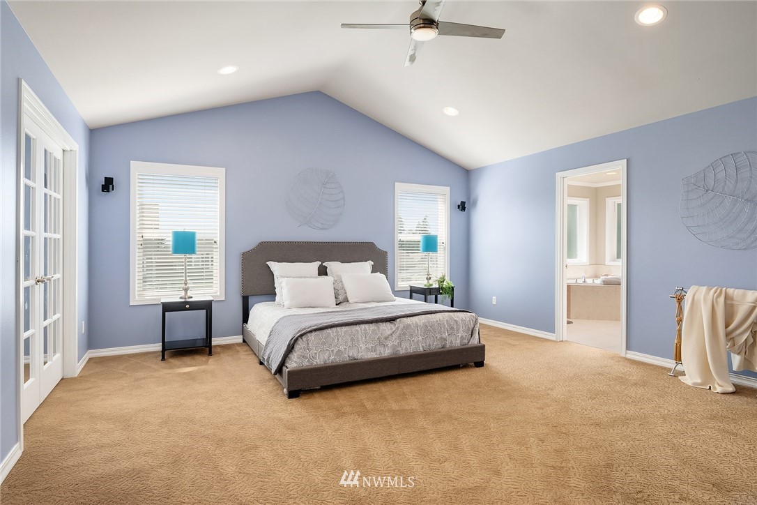 3930 215th Street Southeast Bothell, WA 98021 - Photo 19 of 35 a spacious bedroom with a bed and a cabinets