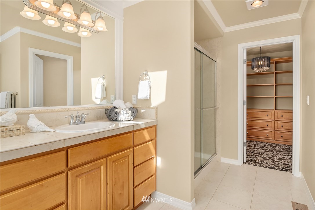 3930 215th Street Southeast Bothell, WA 98021 - Photo 23 of 35 a bathroom with a sink and a mirror