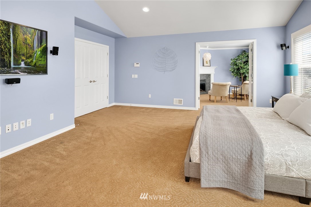 3930 215th Street Southeast Bothell, WA 98021 - Photo 25 of 35 a bedroom with a bed and a flat screen tv