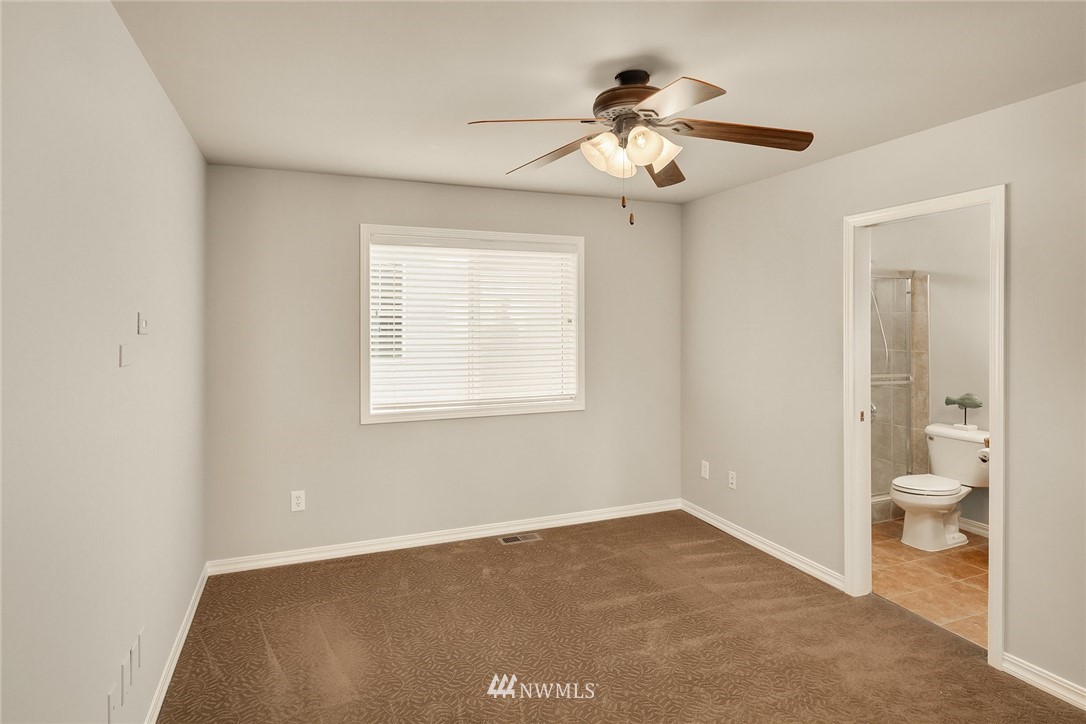3930 215th Street Southeast Bothell, WA 98021 - Photo 26 of 35 a view of an empty room with glass door and a window
