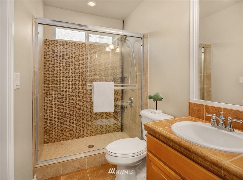 3930 215th Street Southeast Bothell, WA 98021 - Photo 27 of 35 a bathroom with a sink toilet and shower