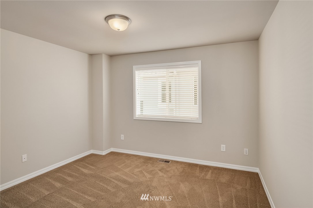 3930 215th Street Southeast Bothell, WA 98021 - Photo 31 of 35 an empty room with a window