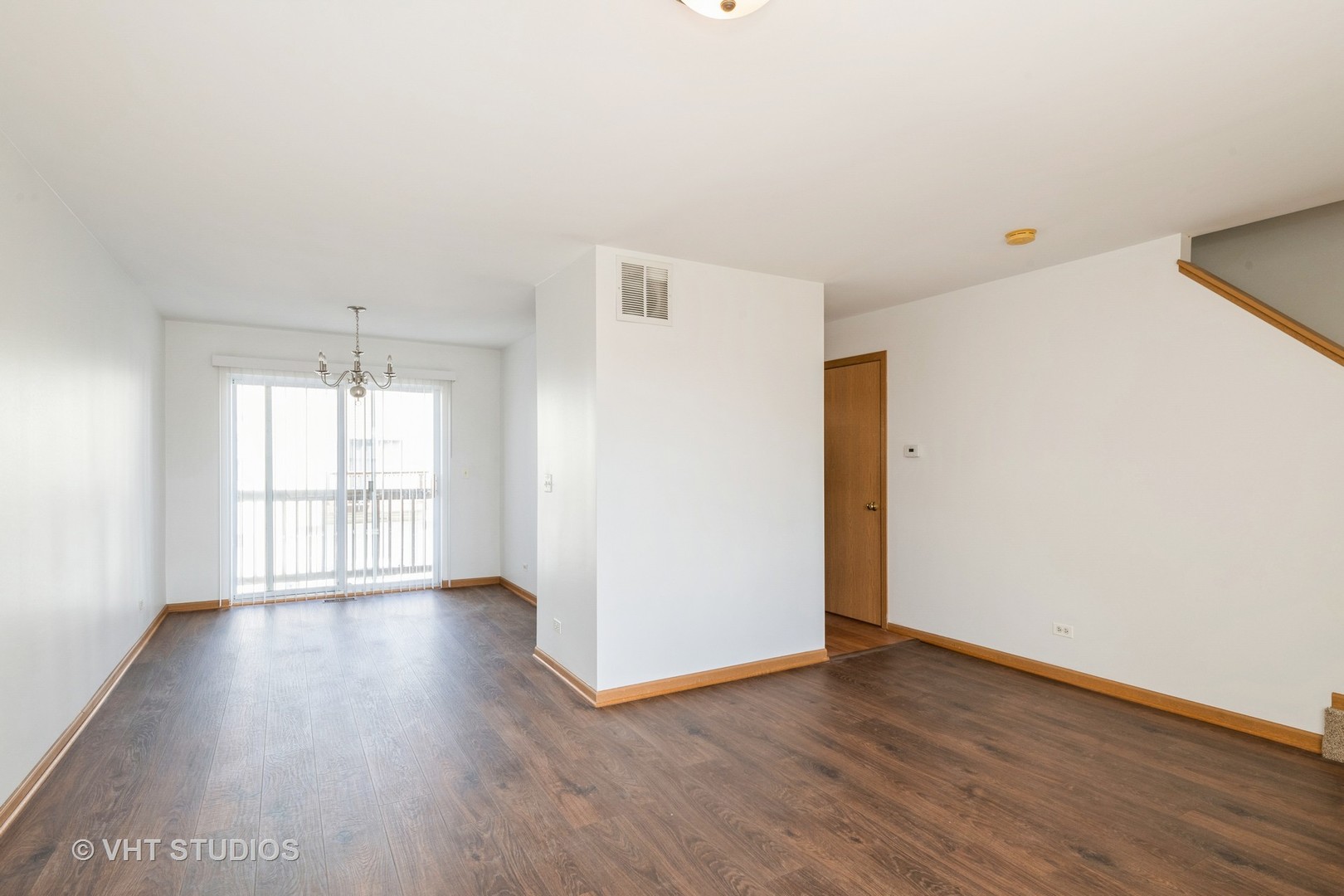 34296 North Barberry Road Round Lake, IL 60073 - Photo 5 of 10 a view of an empty room with wooden floor and a window