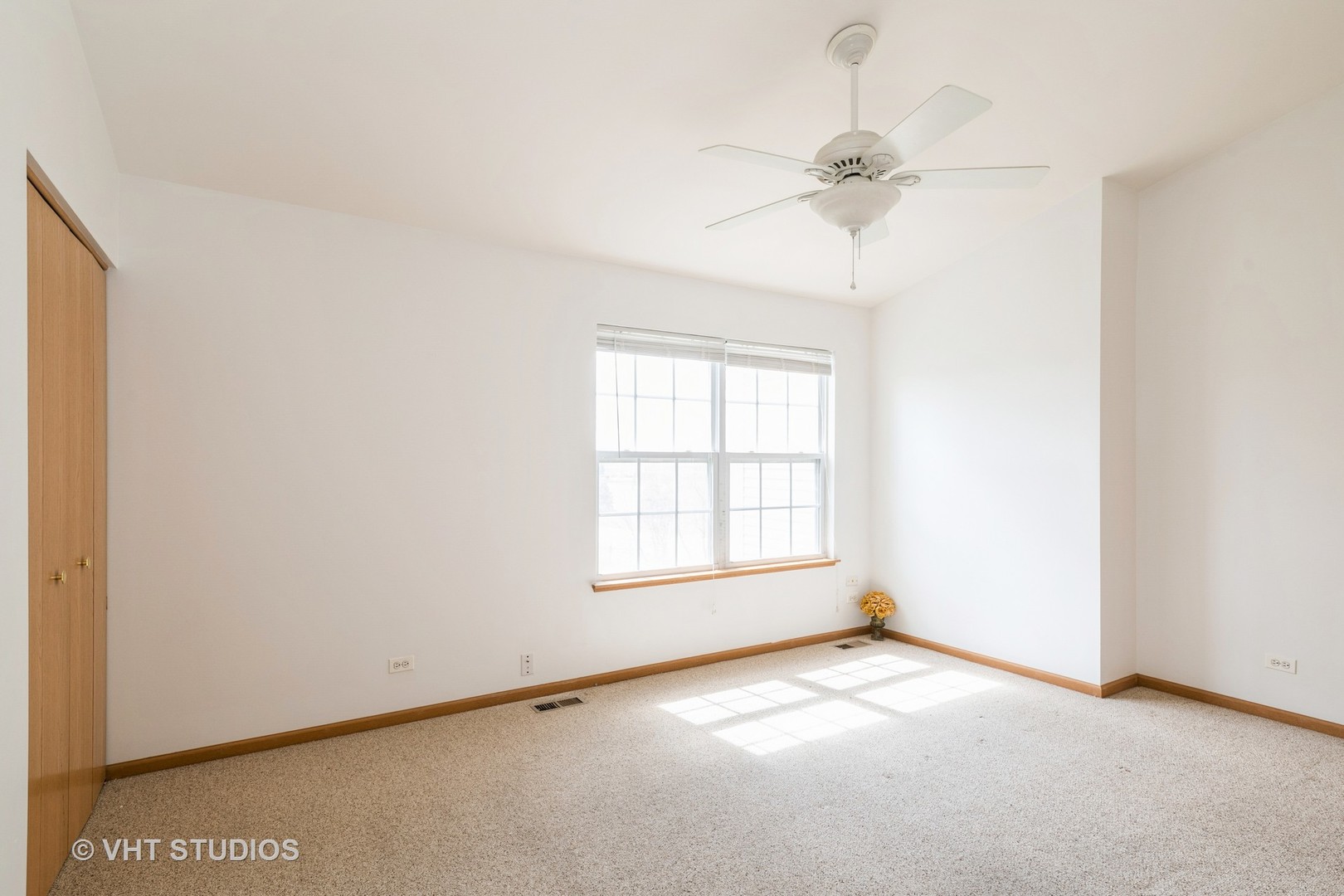 34296 North Barberry Road Round Lake, IL 60073 - Photo 6 of 10 an empty room with a window and a fan