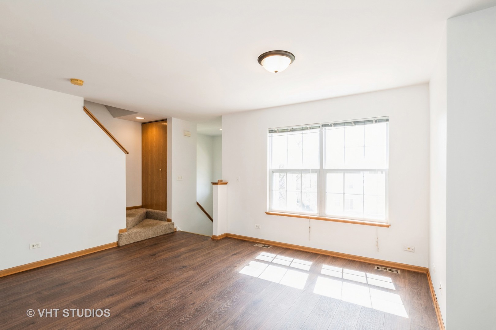 34296 North Barberry Road Round Lake, IL 60073 - Photo 9 of 10 an empty room with wooden floor and windows