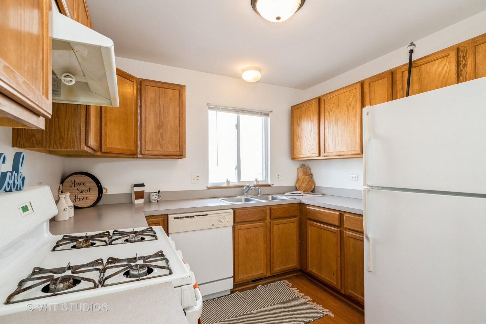34296 North Barberry Road Round Lake, IL 60073 - Photo 10 of 10 a kitchen with a sink a stove and cabinets