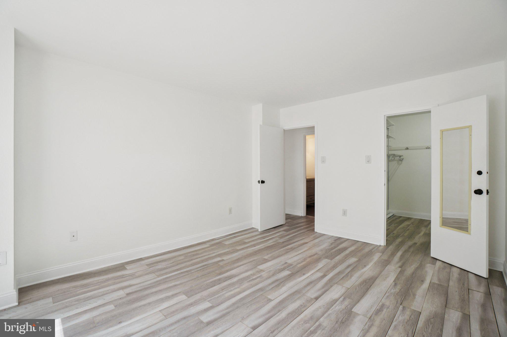 2059 Huntington Avenue, Unit 111 Alexandria, VA 22303 - Photo 26 of 34 a view of an empty room with wooden floor