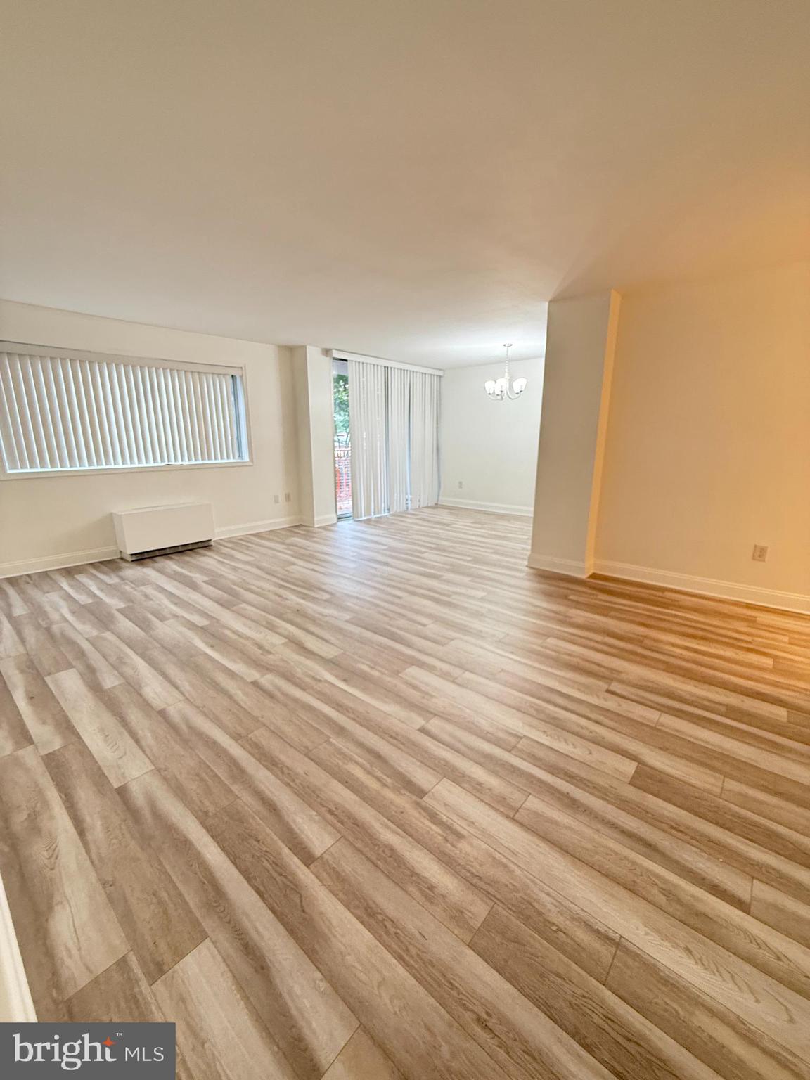 2059 Huntington Avenue, Unit 111 Alexandria, VA 22303 - Photo 7 of 34 a view of an empty room with wooden floor