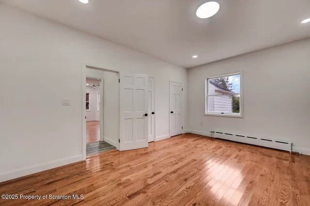 a view of entryway with wooden floor