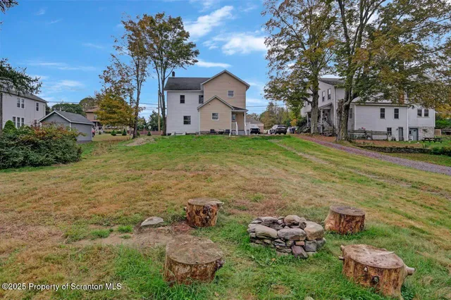 a living room with furniture and a large mirror