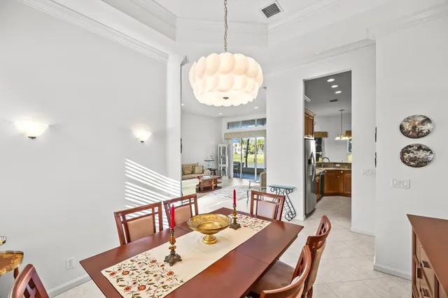 a kitchen with stainless steel appliances granite countertop sink and a refrigerator