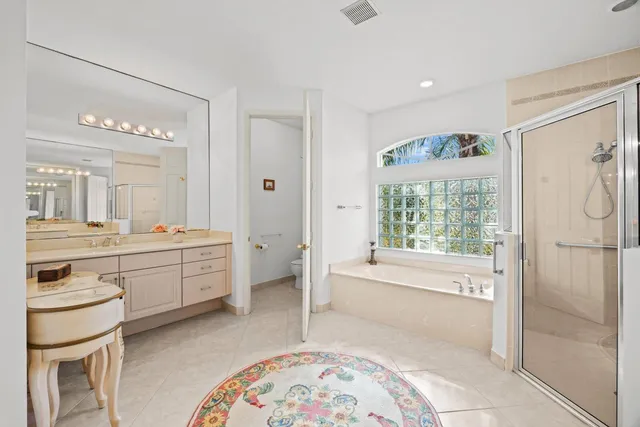 a view of room with window and a ceiling fan