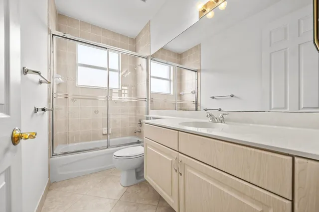a view of a patio with a table and chairs
