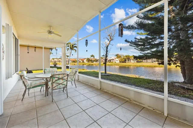 an aerial view of a houses with a swimming pool