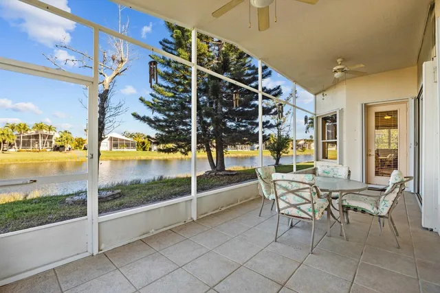 an aerial view of a house with a swimming pool yard and outdoor seating
