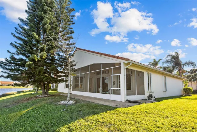 an aerial view of houses with yard