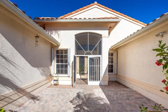 a view of a house with wooden floor and fence