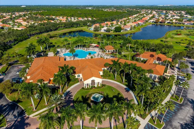 a view of a swimming pool with a yard