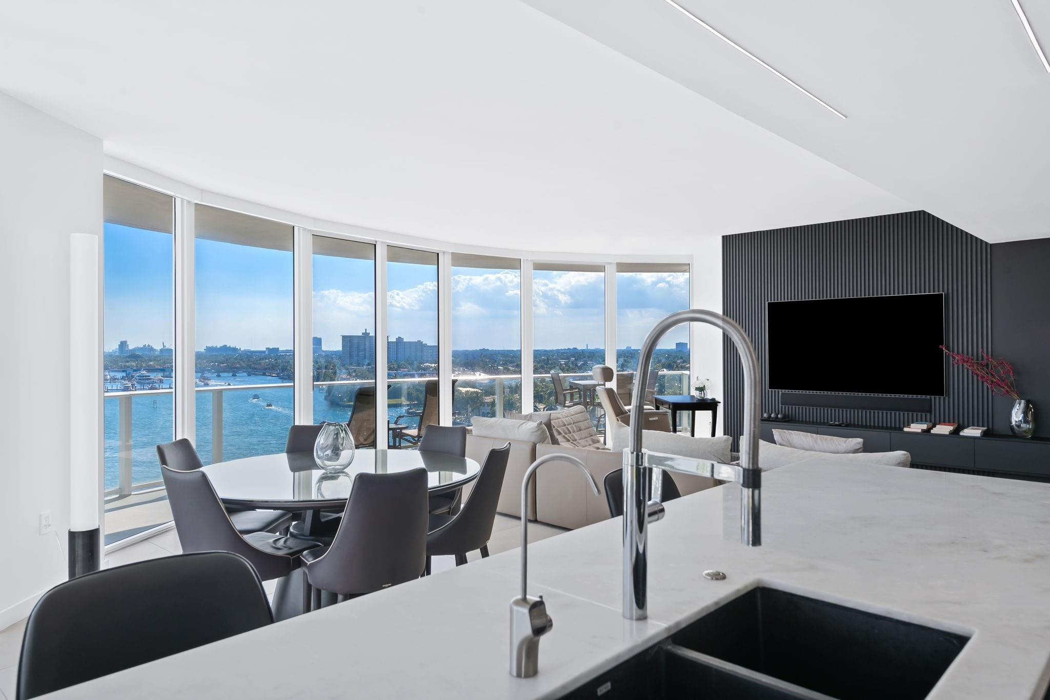 401 North Birch Road, Unit 1100 Fort Lauderdale, FL 33304 - Photo 1 of 30 a living room with furniture and a flat screen tv