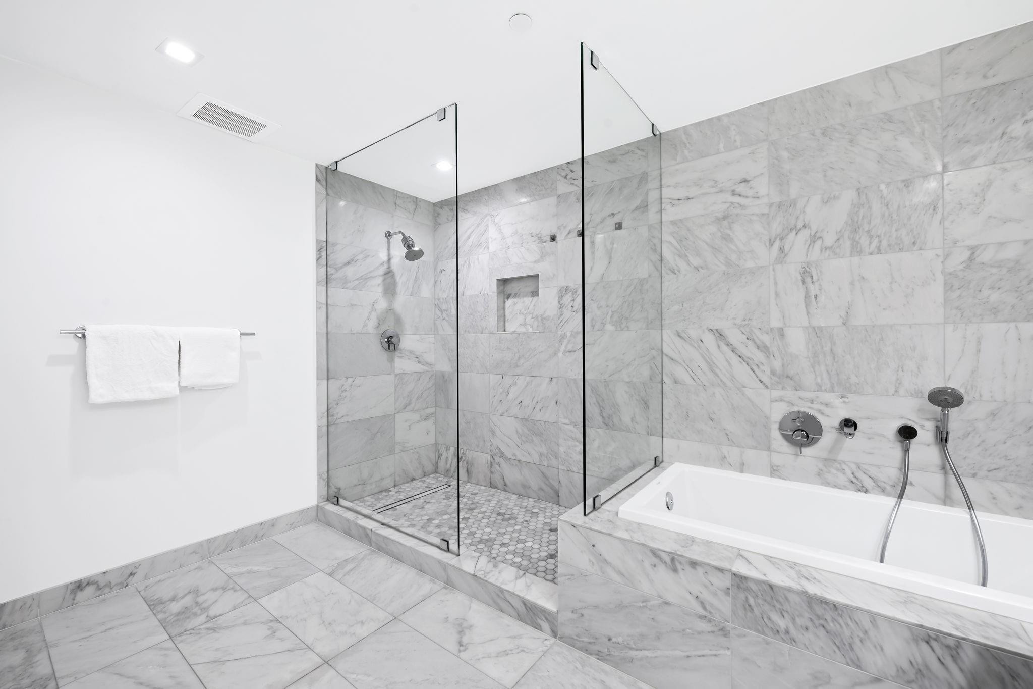 401 North Birch Road, Unit 1100 Fort Lauderdale, FL 33304 - Photo 12 of 30 a bathroom with a bathtub and a shower