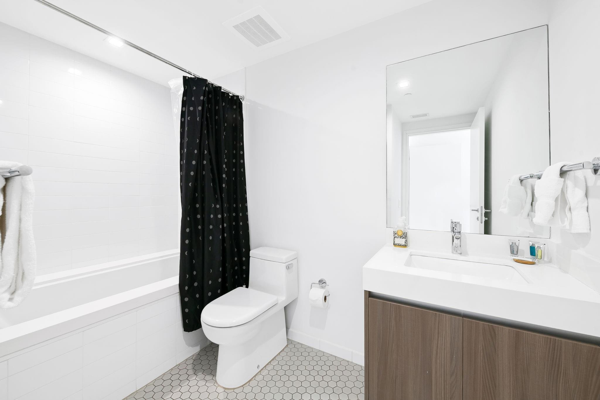 401 North Birch Road, Unit 1100 Fort Lauderdale, FL 33304 - Photo 17 of 30 a bathroom with a sink toilet and shower