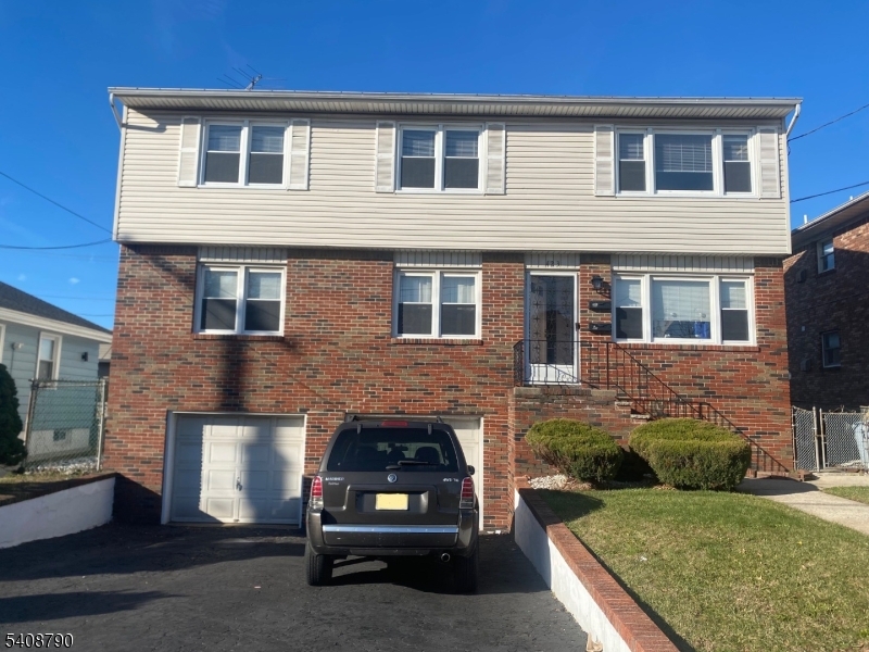 423 Clarkson Avenue, Unit 2 Elizabeth, NJ 07202 - Photo 5 of 16 a view of a house with a yard and sitting area